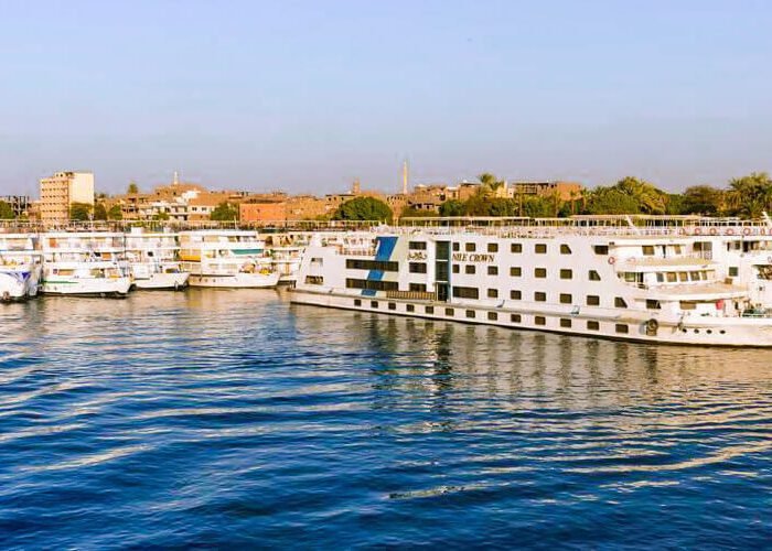 Luxurious 5-star Nile cruise between Luxor and Aswan, showcasing stunning river views and elegant accommodations.