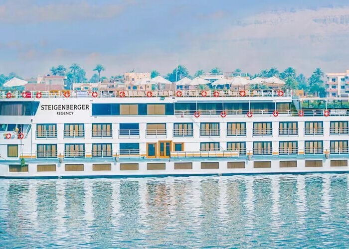Steigenberger Cruises scenic view showcasing luxury liners on a tranquil waterway.
