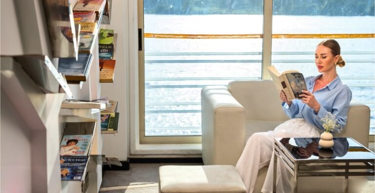 A beautiful woman reading and relaxing on a river cruise.