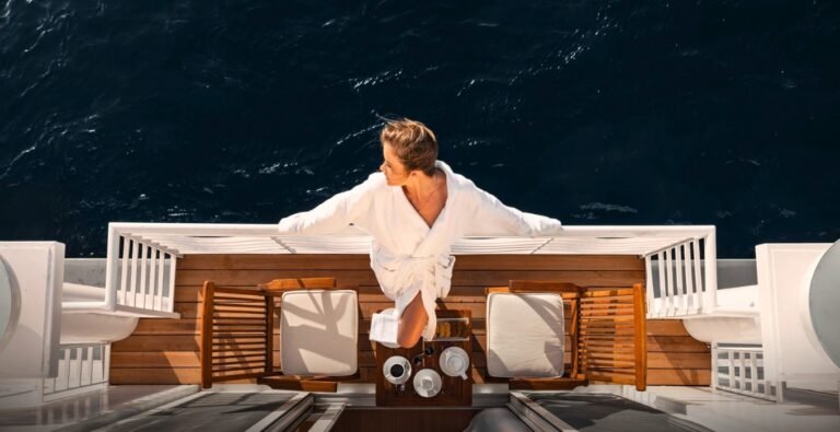 Gorgeous woman enjoying breakfast on a luxury Nile cruise, savoring the fresh air.