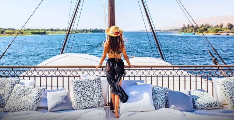 gorgeous-woman-enjoying-her-time-on-the-nile-river-cruise Gorgeous woman enjoying a leisurely moment on a Nile River cruise.