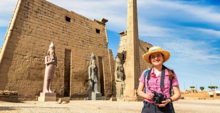 female-solo-traveler-in-luxor-temple Female solo traveler exploring Luxor Temple in Egypt.