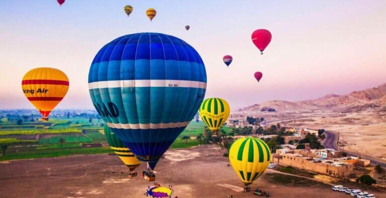 hot-air-balloons-flying-over-the-west-bank-of-the-nile-in-egypt-at-sunrise Hot air balloons soaring over the West Bank of the Nile in Egypt during sunrise.