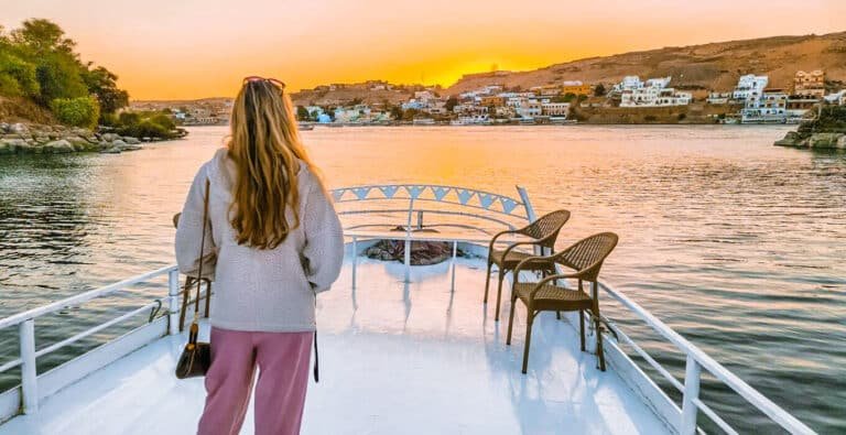 a-foreign-tourist-with-yellow-hair-on-a-boat-on-the-nile-river Foreign tourist with yellow hair on a boat sailing the Nile River.