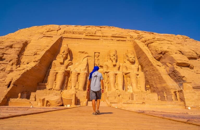 great-photo-of-tourist-visiting-abu-simbel-temple-southern-egypt Tourist exploring Abu Simbel Temple in Southern Egypt.