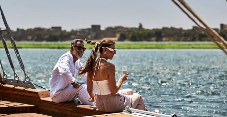 A-wonderful-photo-of-a-couple-sitting-on-a-cruise.