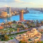 Panoramic aerial view of Cairo, Egypt skyline and Nile River at sunset